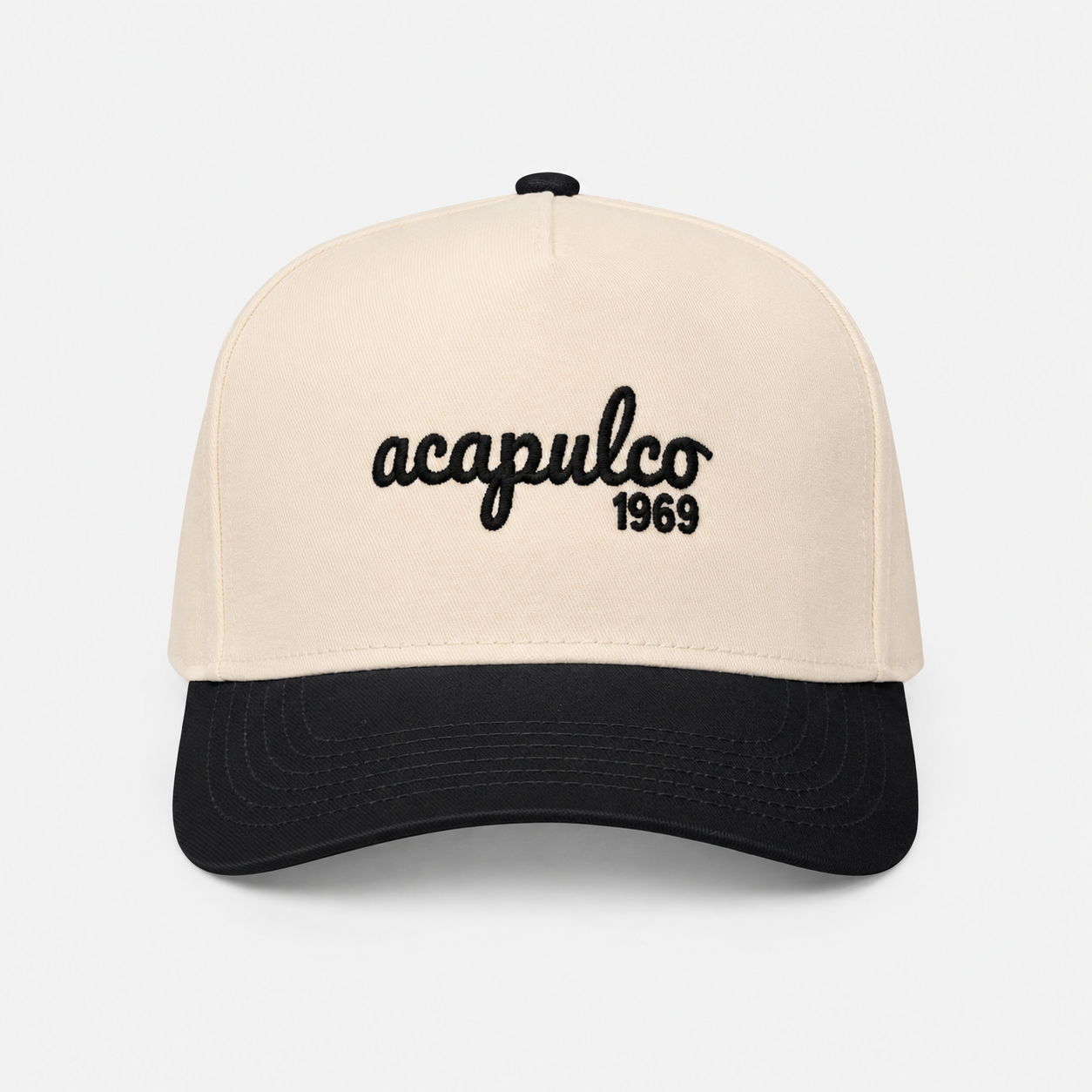 The Acapulco Cap in charcoal and cream — front view with Acapulco 1969 embroidery