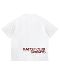 Racket Club Sundays oversized tee in white, back view with burnt red distressed print across the lower back