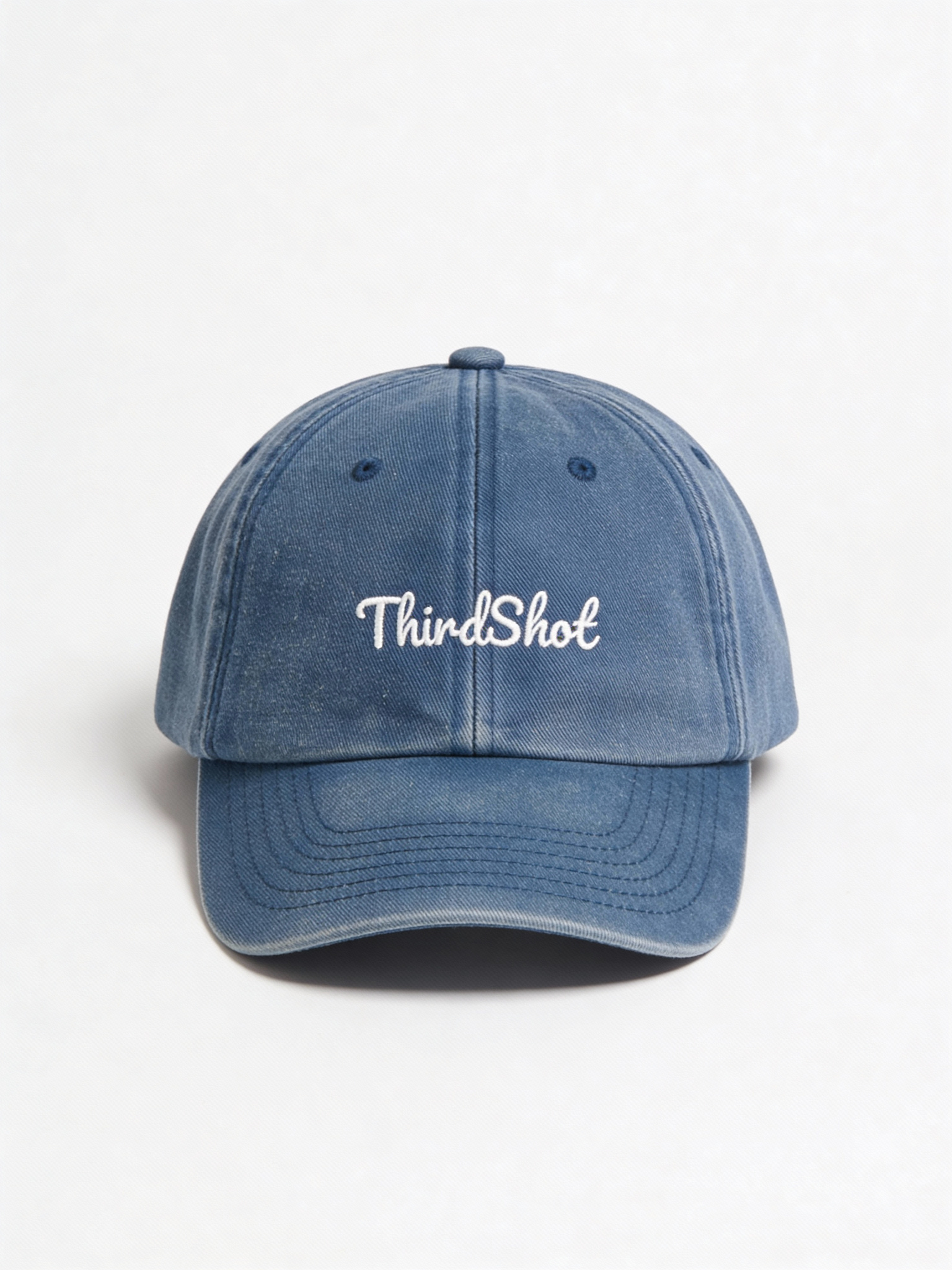 Vintage Wash Cap in washed blue — angled view showing faded low-profile crown