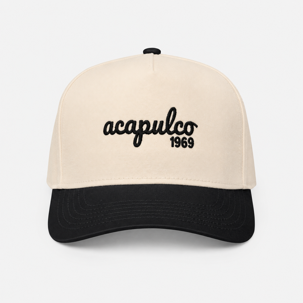 The Acapulco Cap in charcoal and cream — front view with Acapulco 1969 embroidery