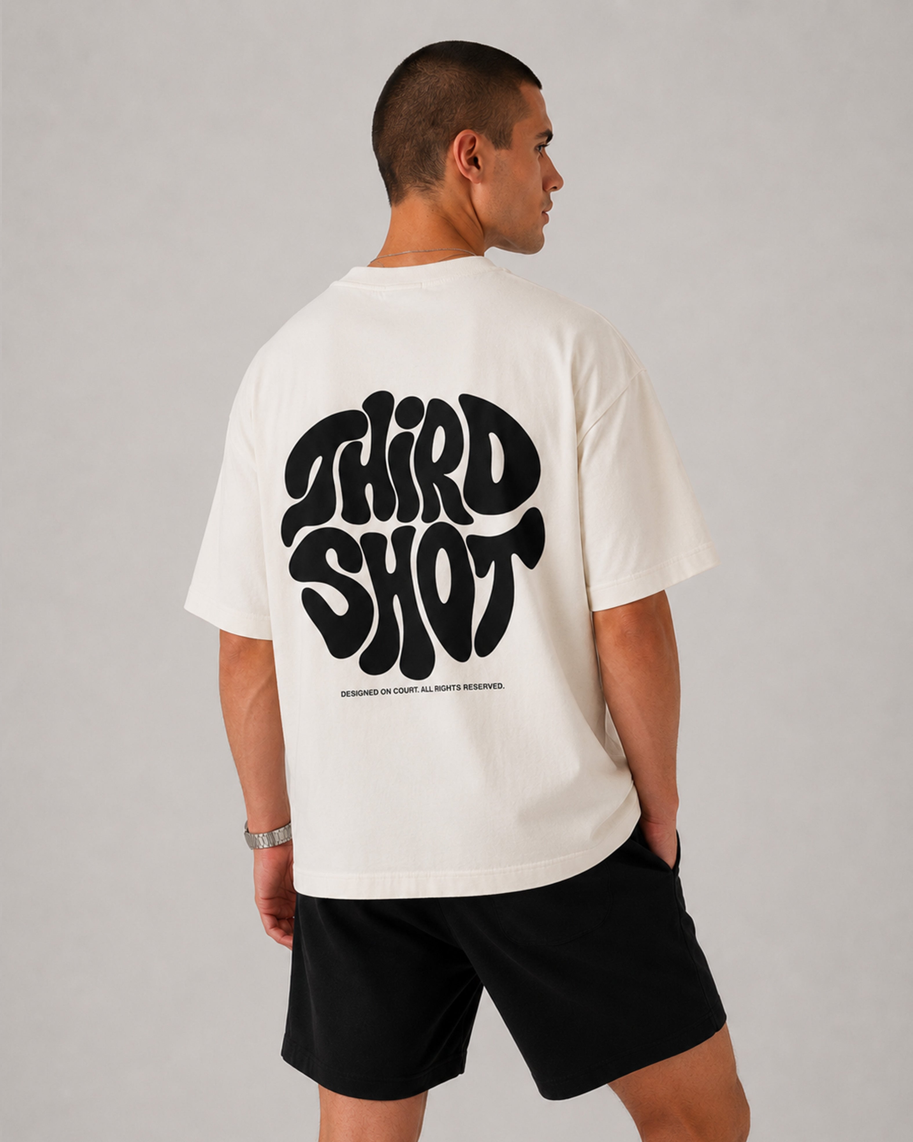 Retro Tee in white and black — flat-lay on the court, Third Shot heavyweight graphic tee
